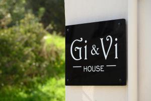 a sign on the side of a house at Gi & Vi House in Agios Nikolaos
