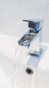 a water faucet on top of a white sink at Westend Hotel & Bar in Nairn +69 photos