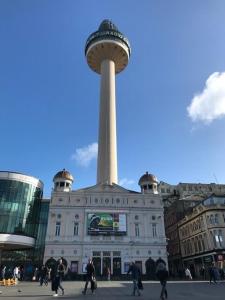 a large building with a tower on top of it at Williamson Suites - Apartment 2 in Liverpool