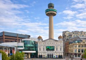a tower in the middle of a city with buildings at Williamson Suites - Apartment 1 in Liverpool