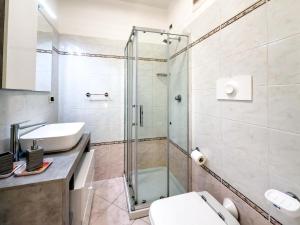 a bathroom with a shower and a toilet and a sink at Rio Apartment cà di Euro with parking in Riomaggiore +33 photos