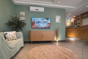 a waiting area of a hospital with a waiting room at Plaza Hotel Gyula in Gyula