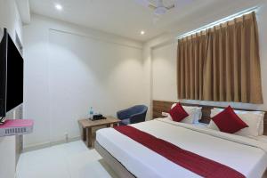 a hotel room with a bed and a television at The Castle Crown - Hotel Scintilla, Somnath in Somnath +34 photos
