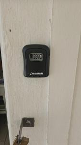 a door with a remote control on the side of it at Escape Root in Caledon