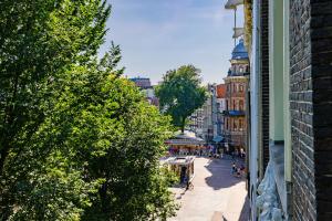 a view of a street in a city with buildings at Supper Boutique Suites in Amsterdam