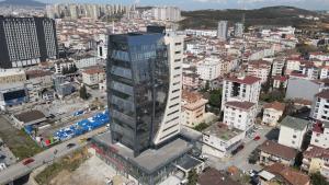 an overhead view of a city with a tall building at Plaza Residence in Tuzla