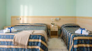 Llit o llits en una habitació de Bahamas Residence & Spa