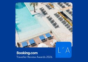 an overhead view of a pool at a resort at L'Azure Hotel SPA 4Sup in Lloret de Mar +63 photos