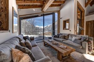 a living room with a couch and a table at Chalet Silver Forest in Chamonix