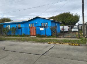a blue building on the side of a street at MiraMar Casa Azul in Puerto Saavedra +9 photos