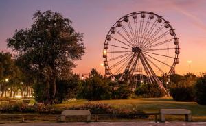 a ferris wheel in a park at dusk at La Dimora del Cuore - U1598 in Olbia
