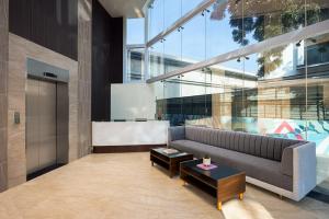 a living room with a couch and a coffee table at Ginger Gurugram, Sector 1 in Gurgaon