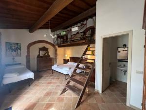 a room with two beds and a bunk bed at LA GRANCIA DEL SANTO in Monticiano