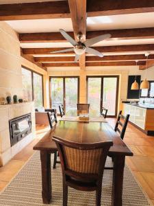 a dining room with a table and a ceiling fan at Torre Picada Duplex in Port de Soller