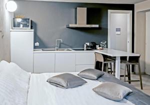 a kitchen with a bed with two pillows on it at Casa Felice by Villa Porta Collection in Luino