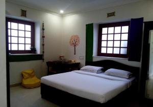 Postel nebo postele na pokoji v ubytování Hotel Ritz + 35 fotografií