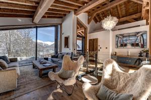 a living room with a couch and chairs at Chalet Silver Forest in Chamonix