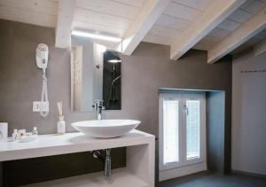 a bathroom with a white sink and a mirror at Casa Felice by Villa Porta Collection in Luino