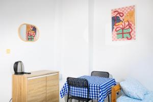 a dining room with a table and a chair at Hostel Jamnik in Psary