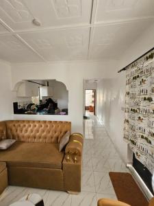 a living room with a couch and a fireplace at Malindi Jerere BnB in Malindi