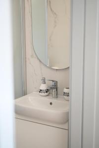 a bathroom with a sink and a mirror at Ca' Tra Cielo e Monti in Frassinoro +87 photos