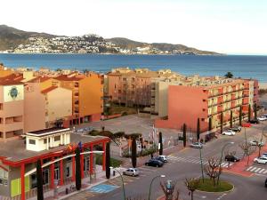 an aerial view of a city with buildings and the ocean at Apartment Empuriabrava by Beach & Canals in Empuriabrava