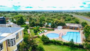 an aerial view of a house with a swimming pool at Amboseli Gateway Hotel in Kimana