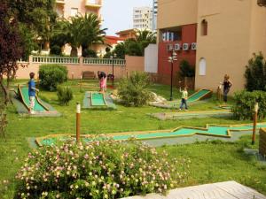 a group of children playing in a park at Apartment Empuriabrava by Beach & Canals in Empuriabrava