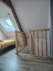 a room with a bunk bed and a staircase at Jauxvial 1 in Jaux