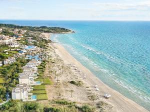 an aerial view of a beach with umbrellas at Mandola Rosa, A Resort to Live in Loutra Killinis