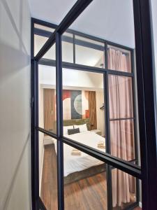 a view of a bedroom through a window at By The Pool Apartments #7 in Velingrad
