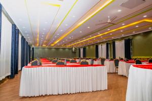 a row of tables and chairs in a banquet hall at Amboseli Gateway Hotel in Kimana