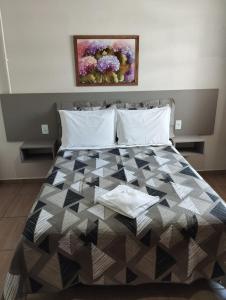 Llit o llits en una habitació de Hotel Veneza