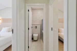 a bathroom with a toilet in a room at Setúbal Serenity Villa I, By Home Match in Setúbal +16 photos