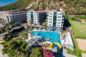 an aerial view of a resort with a swimming pool at Grand Ring Hotel in Beldibi