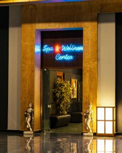 a store front with two statues in front of it at Grand Ring Hotel in Beldibi +64 photos
