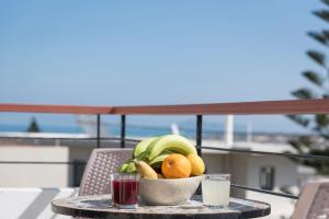 a bowl of fruit on a table on a balcony at Villa Nina with Private Pool in Kolymvari