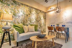 a living room with a couch and a table at Aeon Towers Davao Condotel near Abreeza Ayala Mall in Davao City