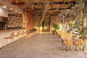 a row of chairs and tables in a restaurant at Defne Beach Karya in Fethiye
