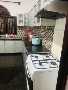 a kitchen with a stove top oven in a kitchen at Senuka Villa in Mirissa