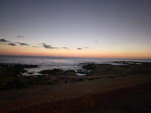 a view of the ocean at sunset at Maltese Sunshine in Naxxar