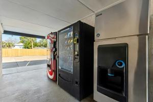 a video game vending machine in a building at Red Roof Inn Panama City Beach in Panama City Beach