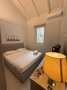 a bedroom with a bed and a table and a chair at Monza Downtown House Via Bartolomeo Zucchi 5 Monza in Monza