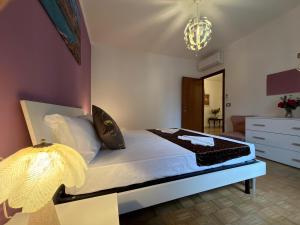 a bedroom with a bed and a lamp at CA'venezia in Mestre +19 photos