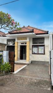 a house with a gate in front of it at Amerthya Villa in Banjar