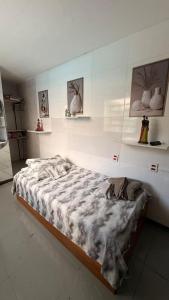 a bedroom with a large bed in a room at Alure 1 in Belo Horizonte +7 photos