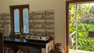 a bathroom with a sink and a mirror at Raindrop Homestay Havelock in Sir William Peel Island