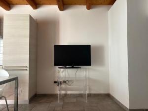 a living room with a flat screen tv on a wall at Ancient village in Trieste