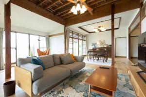 a living room with a couch and a table at 太宰府らたん - Dazaifu Ratan in Dazaifu