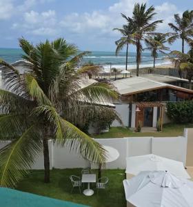 a view of the beach from the balcony of a resort at Mar e Sol Tabatinga in Nísia Floresta
